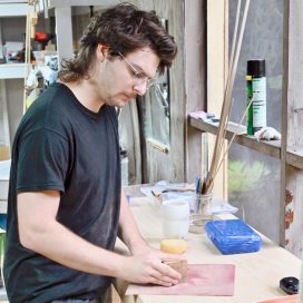 Zachary Morphew sanding wood