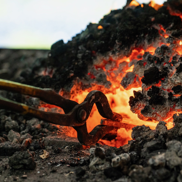 tongs in fire open studio